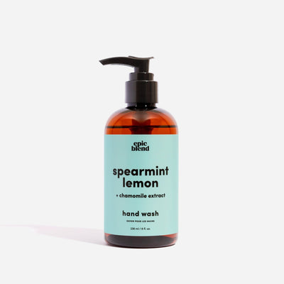 An amber plastic pump bottle of Epic Blend Spearmint Lemon Hand Wash with a light blue label. The label specifies 