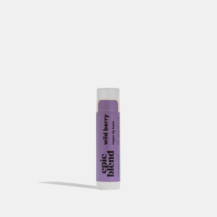 A purple tube of Epic Blend Wild Berry Vegan Lip Balm. The label on the tube features the product name and indicates that it is vegan.