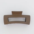 Brown hair clip on a white background