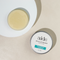 Aide Bodycare Eucalyptus Lavender Solid Lotion Bar, featuring a round, solid bar and a tin container with the 'aide' logo and 'Eucalyptus Lavender' text, displayed on a light-colored surface. The lotion bar is natural and handmade, available in Ottawa, Ontario, Canada.