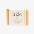 Bar of soap with 'aide' branding on a white background