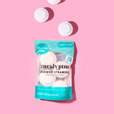 Pack of eucalyptus shower steamers on a pink background