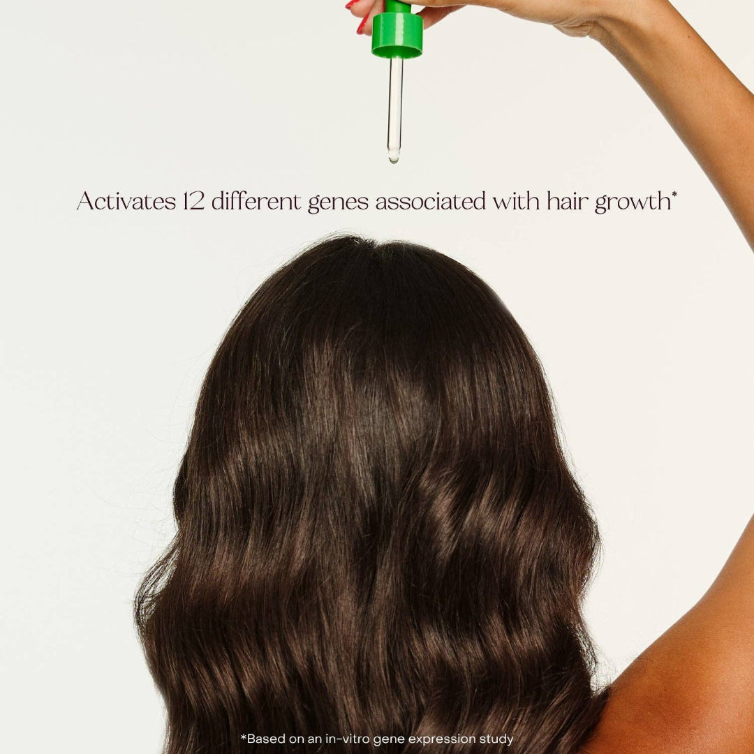 Person with long dark hair holding a dropper over it, with text about gene activation for hair growth.