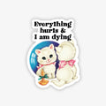 Sticker with a cartoon cat and text 'Everything hurts & I am dying' on a white background