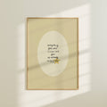 Framed artwork with motivational quote on a beige wall