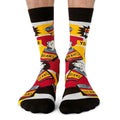 Colorful socks with bean can design worn by a person on a white background