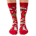 Red socks with Christmas-themed cat designs on a white background
