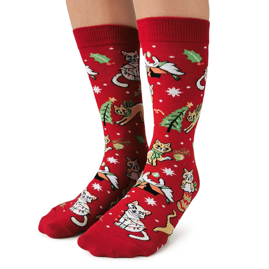 Red socks with cat-themed pattern on a white background
