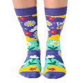 Colorful socks with floral patterns and text on a white background