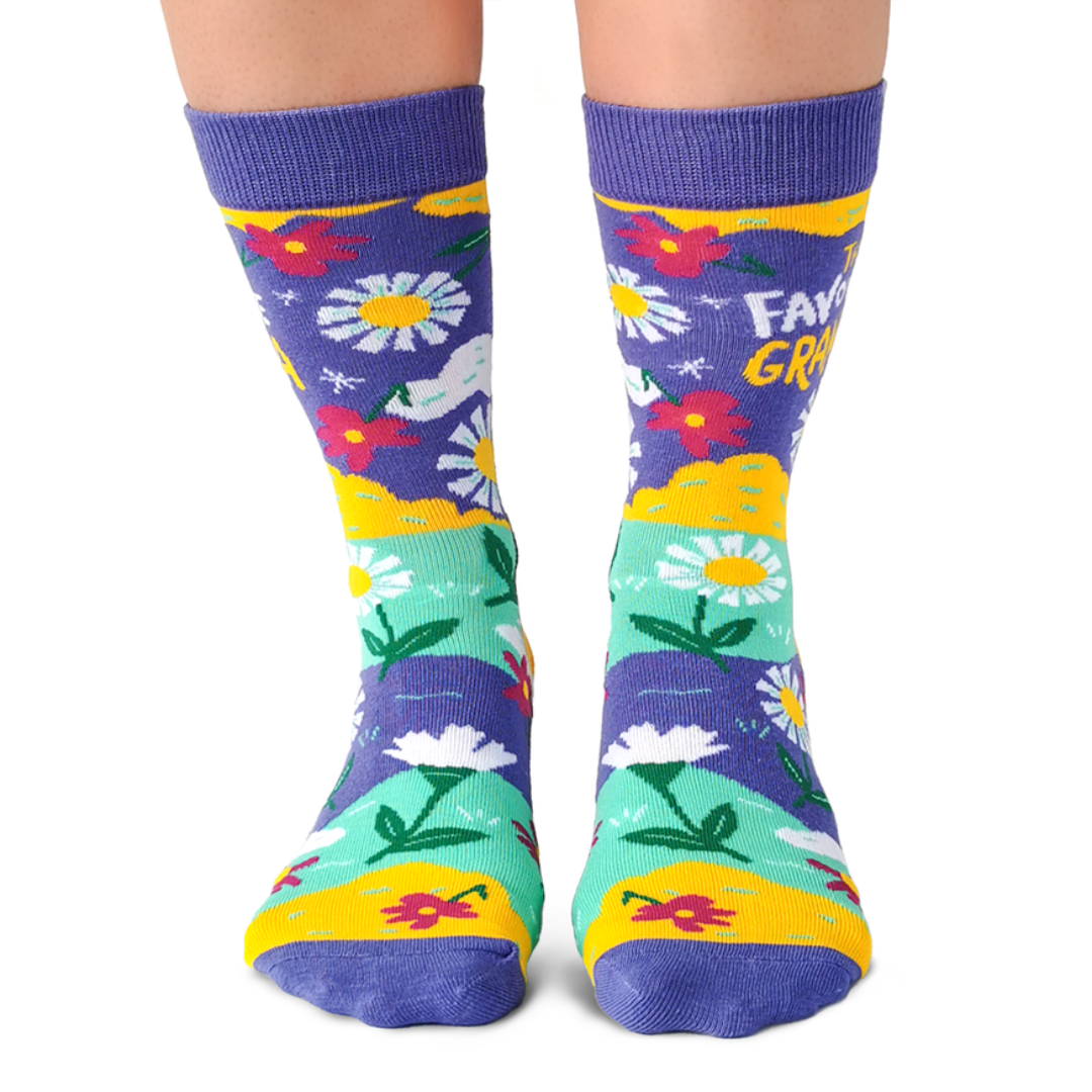 Colorful socks with floral patterns and text on a white background