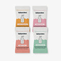 Four packages of naturebee foaming hand soap tablets on a white background