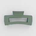 Green hair clip on a white background