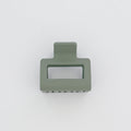 Green rectangular object with cutout on a white background