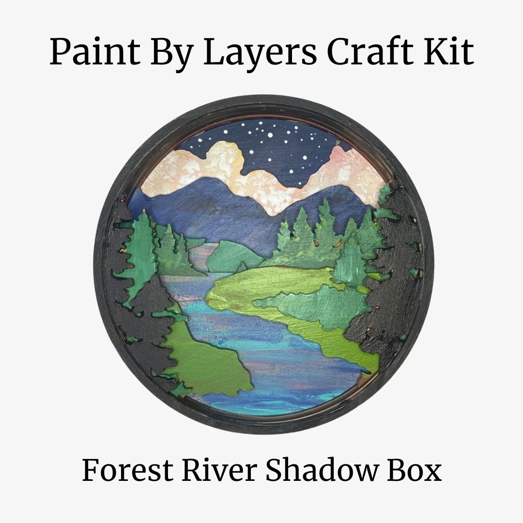 Forest River Shadow Box craft kit with mountains, trees, and water on a white background