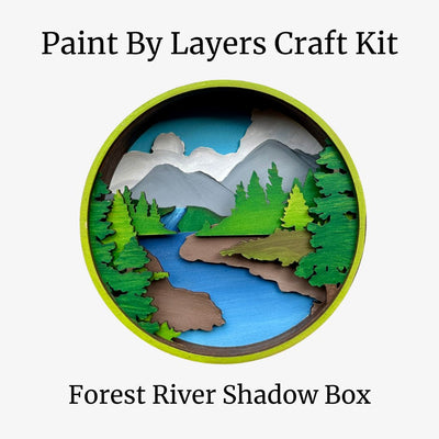 Forest River Shadow Box craft kit with mountains, trees, and river on a white background