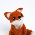 Felted fox toy on a white background