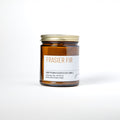 Frasier Fir candle in amber jar with white label on white background