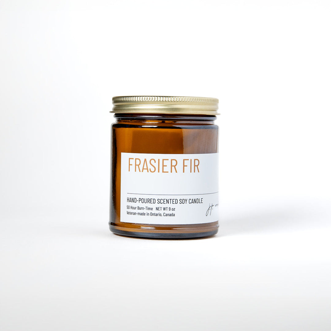 Frasier Fir candle in amber jar with white label on white background