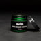 A dark green glass jar with a black lid. The jar is filled with beard butter and has a black label with the text 