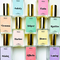 A collection of ten perfume bottles arranged in a grid. Each bottle has a gold cap and a transparent body, revealing the colored liquid inside. Each bottle has a label with the perfume's name and a list of its fragrance notes. The names include Aubrey, Zaida, Gemma, Draper, Harlow, Bianca, Renfrew, Ophelia, Laurent, and Violet.