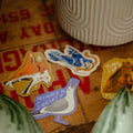 Stickers on a wooden surface with a blurred background