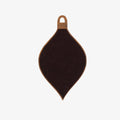A wooden ornament shaped like a teardrop. The ornament is decorated with colorful embroidery stitches in a geometric diamond pattern.