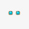 A set of three pairs of turquoise earrings displayed on a blue card. The set includes a pair of stud earrings, a pair of bar earrings with small turquoise beads, and a pair of hoop earrings with dangling turquoise stones. The card has the month 