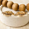 A pair of gold, double-layered hoop earrings.