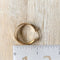 A pair of gold, double-layered hoop earrings.