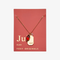 A gold necklace with a ruby stone pendant. The pendant also has the word 