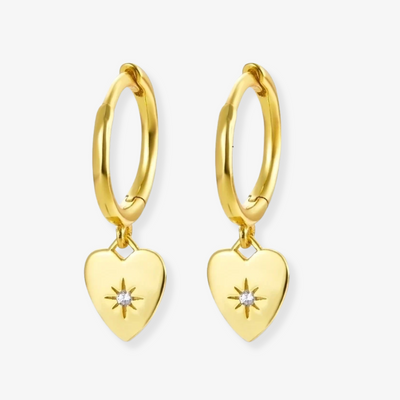 Gold plated heart drop earrings, featuring small gold hoops with dangling heart charms, each adorned with a central sparkling crystal. These romantic earrings are available in Ottawa, Ontario, Canada.
