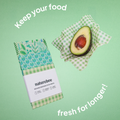 An image of the Beeswax Wrap Variety Set and one being used in an envelope style to store blueberries, with the text "keep your food fresh for longer".