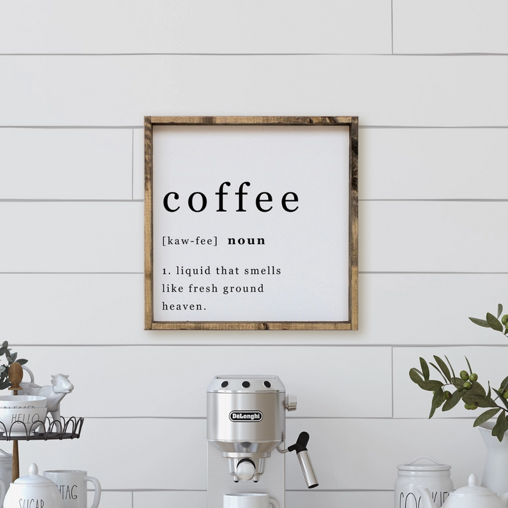 A framed square wood sign with the text 
