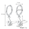 White gold plated diamond drop earrings featuring small hoops with dangling rhombus-shaped charms, each with a central sparkling crystal resembling a North Star. These elegant earrings are available in Ottawa, Ontario, Canada.