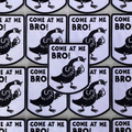 An iron-on patch featuring a cartoon Canada Goose in an aggressive stance with raised wings, accompanied by the text 'COME AT ME BRO!' in bold black letters on a white background with a black border. This funny and novelty patch is likely popular in Ottawa, Ontario, Canada, due to the presence of Canada Geese.
