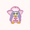 A pink sticker with a cartoon illustration of a Furby toy. The Furby has green eyes, a pink head, and a purple body. The text 