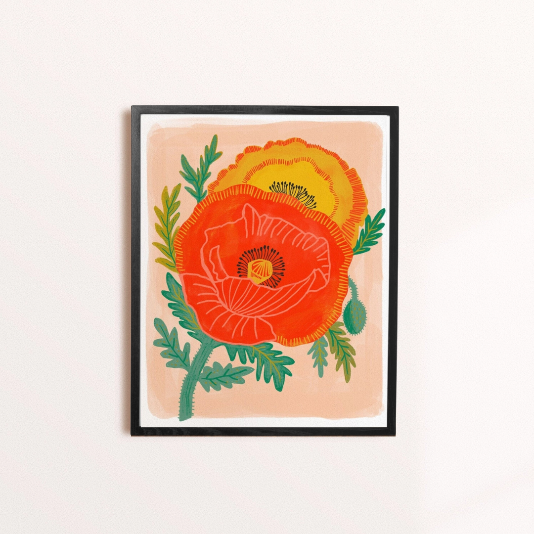 Poppy Garden Framed Art Print, a colourful art print of two bright poppies on a pink background, in a black frame.