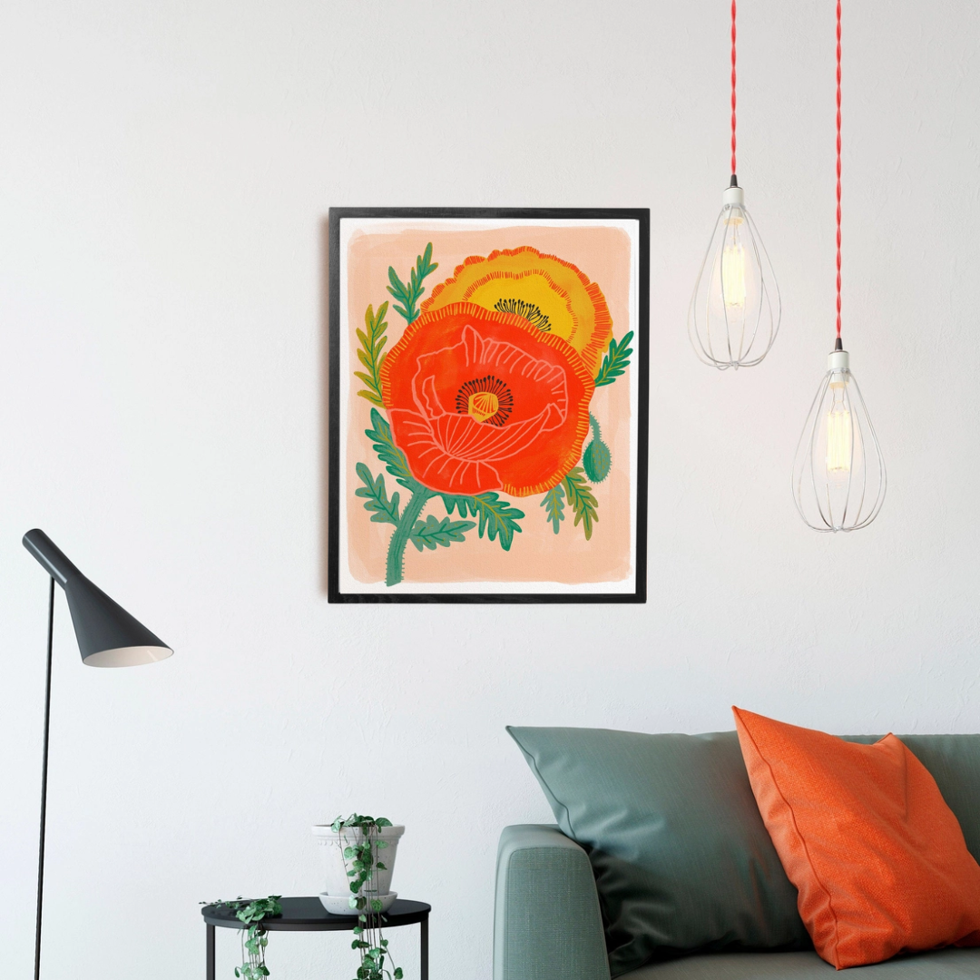 Poppy Garden Framed Art Print, a colourful art print of two bright poppies on a pink background, in a black frame.