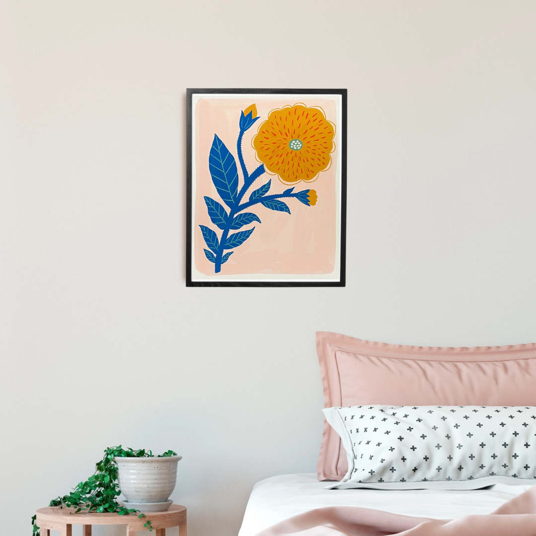 Yellow Flower Framed Art Print, a poster of a yellow flower on a peachy background in a black frame.