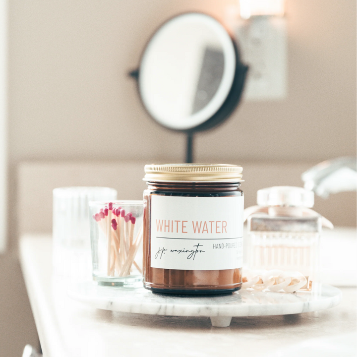 The Whitewater Candle is hand poured and contain simple ingredients Product Photo Staged In Bathroom