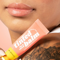 Red-dy or Not Lip & Cheek Tinted Balm, a liquid blush used on a asian woman's eyes, cheeks and lips.