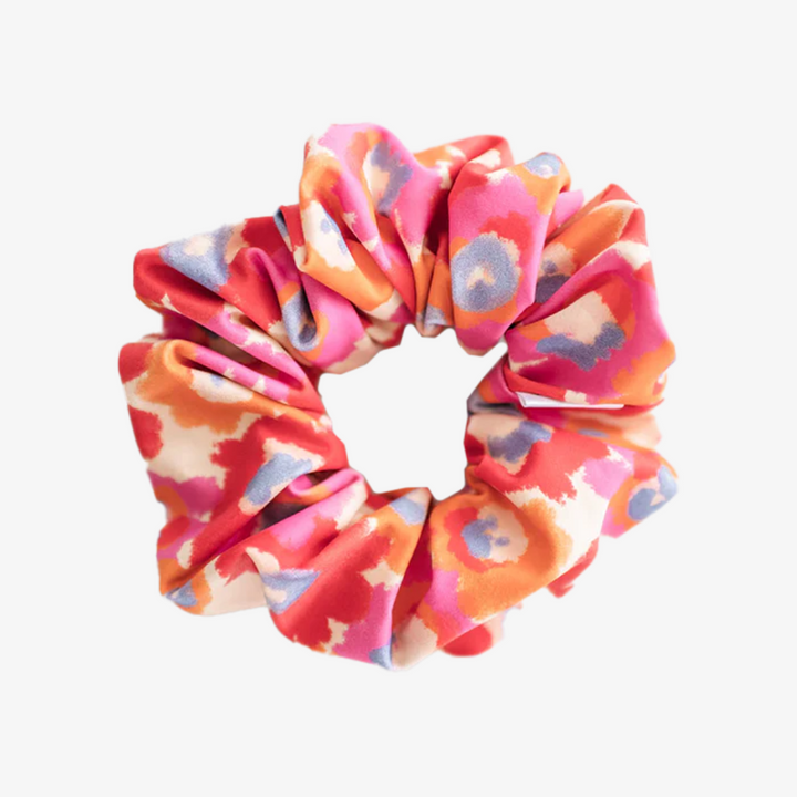 Flower Child Petite Scunchie, a fluffy hair tie in a rainbow of tiedye colours.