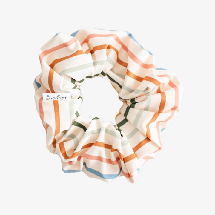 Sundeck Stripes Petite Scunchie, a fluffy hair tie in a creamy white with a rainbow of stripes.
