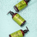 An amber plastic pump bottle of Epic Blend Coconut Lime Hand Wash with a lime green label. The label specifies "coconut lime + chamomile extract" and "hand wash".