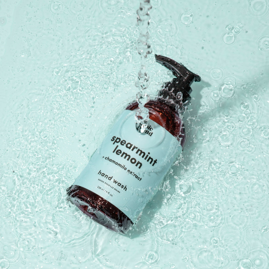 An amber plastic pump bottle of Epic Blend Spearmint Lemon Hand Wash with a light blue label. The label specifies "spearmint lemon + chamomile extract" and "hand wash".