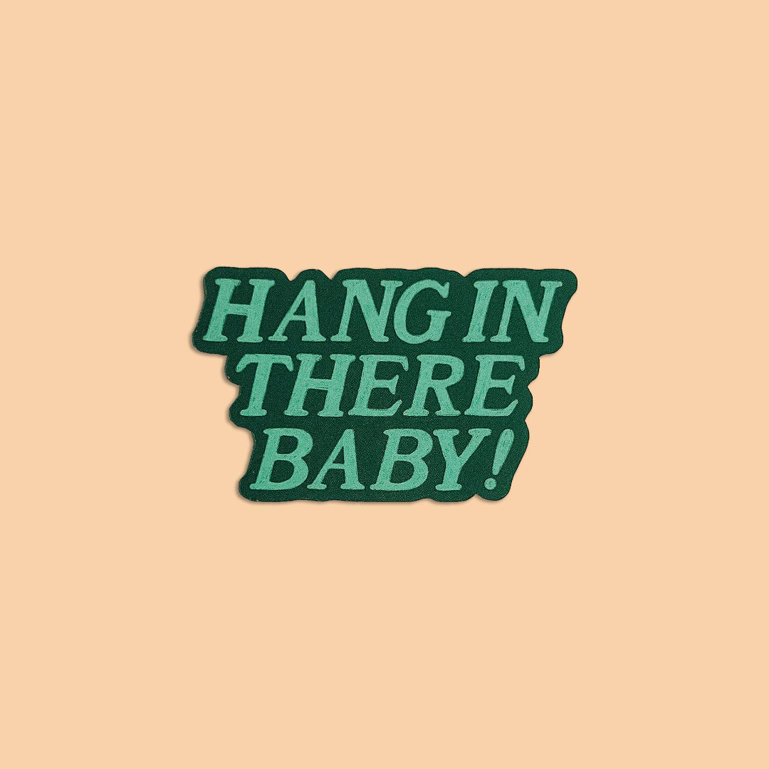 Green text 'HANG IN THERE BABY!' on a beige background