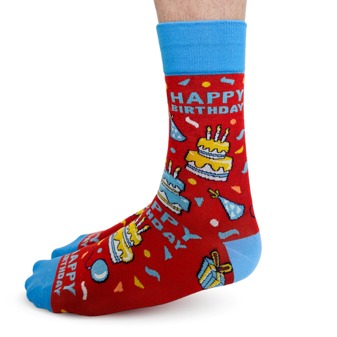 Red birthday-themed sock with blue accents on a white background