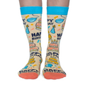 Birthday-themed socks with colorful graphics on a white background