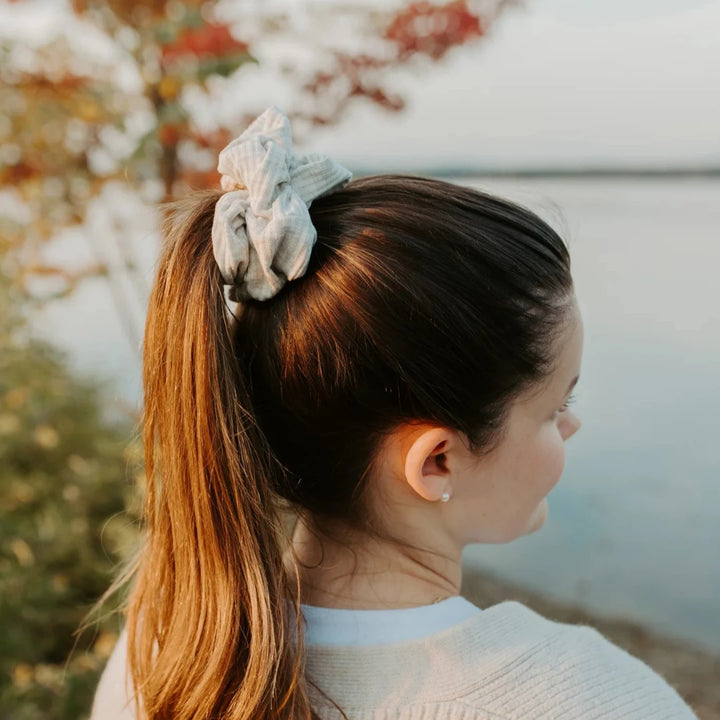 A light grey ribbed scrunchie.