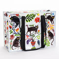 A rectangular shoulder tote bag with black handles, featuring a whimsical pattern of black cats, colourful flowers, and foliage against a white background.